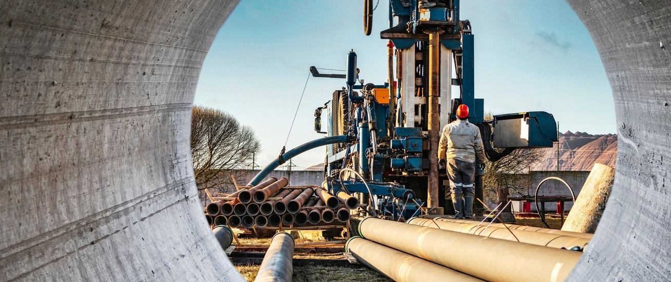 A man supervising a drilling rig